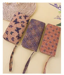 Set of three bohemian cork pattern long wallets featuring wrist straps and zippers