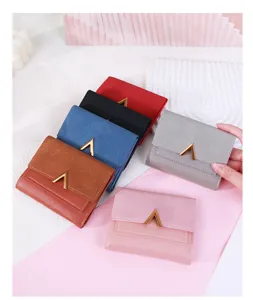 Various colors of women's tri-fold wallets featuring matte PU leather and gold V-shaped buckle