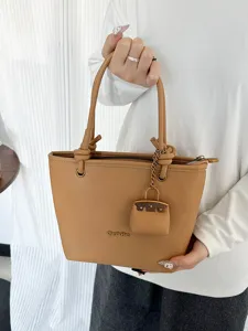 Large capacity lychee pattern tote bag with stylish pouch charm for modern women.