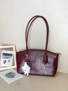 Elegant burgundy crocodile pattern tote bag for women with stylish white fluffy charm.