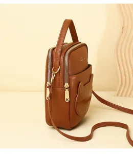 Close-up detail of a brown mini crossbody phone bag with a cute cat-ear textured pocket