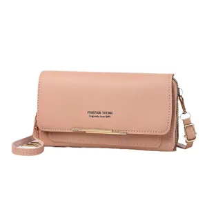 Dusty rose PU leather crossbody phone bag with double zippers and Forever Young logo