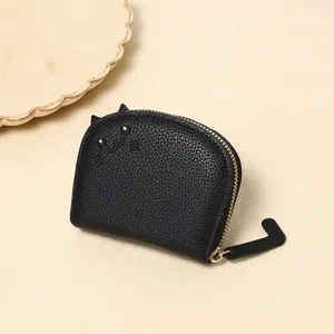 Detailed macro view of a cute black cat coin purse featuring a unique tail zipper pull