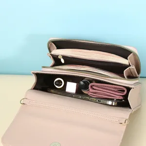 Pink minimalist women's crossbody bag featuring a spacious multi-compartment interior layout