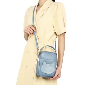 Cute light blue mini crossbody phone bag with cartoon crocodile pattern pocket