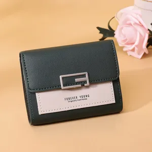 Detailansicht der dunkelgrünen und rosa Bicolor-Damen-Minibörse mit G-Schnalle