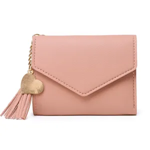 Elegant pink minimalist women's short wallet featuring heart charm and decorative tassel