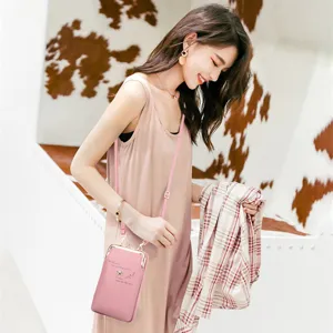 Fashionable pink crossbody cell phone bag for women with elegant embroidered details