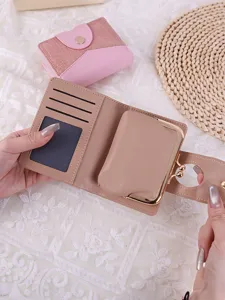 Elegant women's short wallet featuring crocodile pattern and detachable kiss-lock coin purse