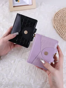 Elegant crocodile pattern short wallets for women featuring a vintage metal snap closure