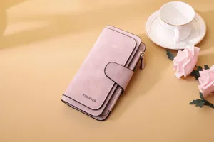 Close-up of pink frosted PU leather women's long wallet with elegant buckle detail