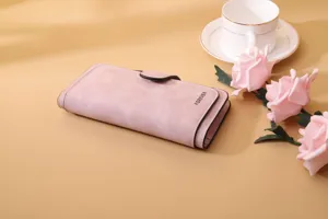 Close-up of pink frosted PU leather long wallet with buckle closure and rose decor