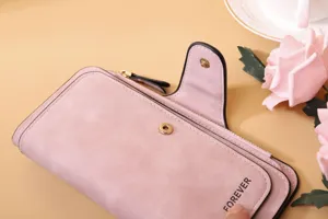 Close-up of pink frosted PU leather women's long wallet showing snap button detail.
