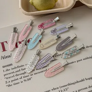 Macro view of assorted colorful hair clips with cute patterns and rhinestone accents