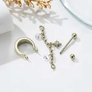 Detailed view of disassembled gold star charm cartilage ear cuff and piercing set