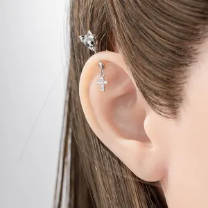 Punk style silver skull and bow industrial piercing barbell with dangling crystal cross
