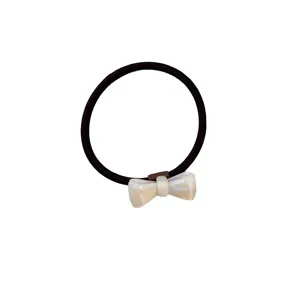 Minimalist black elastic hair tie with an elegant white pearlescent bow charm accessory