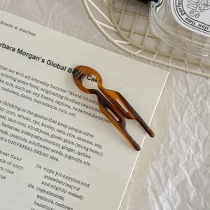 Elegant handmade tortoise shell acetate hair fork for stylish bun hairstyles and updoes.