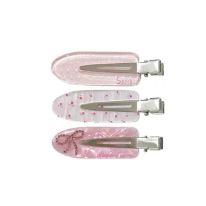 Set of three cute pink no-trace hair clips featuring rhinestone bow and floral patterns