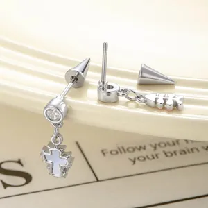 Elegant asymmetrical silver-toned stud earrings featuring cross and fishbone pendants