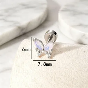 Macro view of a 6x7.8mm delicate titanium steel butterfly earring with shiny opal inlays