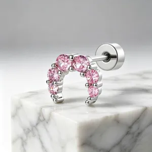 Detailed view of silver moon helix stud with sparkling pink cubic zirconia stones.