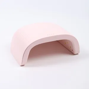 Vista laterale di una lampada per unghie professionale rosa 48W UV LED dal design curvo