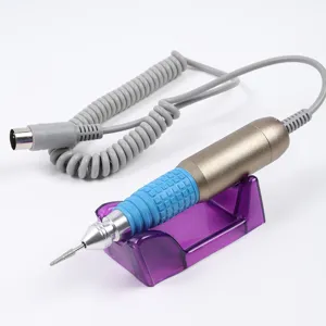 Detailed view of portable metal electric nail drill handpiece with blue rubber grip on stand