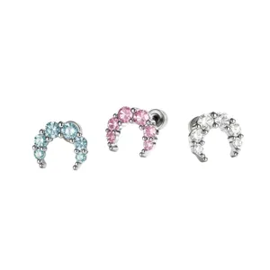 Sparkling crescent moon cartilage stud earrings with light blue, pink, and clear zirconia