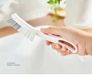 Detailed view of long handle cleaning brush for bathroom crevices