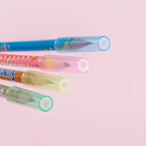 Detailed close-up view of colorful pencil caps and extenders protecting nibs safely.