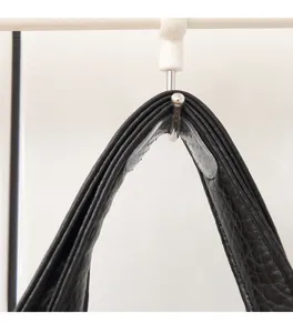 Macro detail of a transparent silicone anti-slip strip applied to a bag shoulder strap