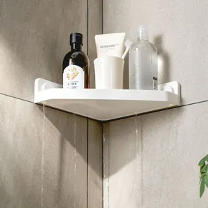 White triangular bathroom corner shelf for wall-mounted storage with drainage holes