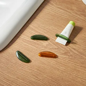 Minimalist manual toothpaste and lotion squeezer clips for various tube products