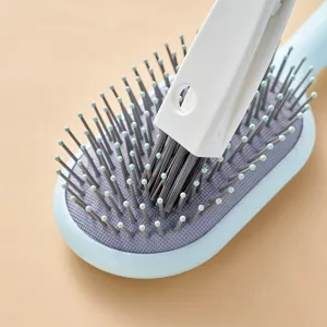 Professionele witte haarborstel reinigingstool voor een blauwe luchtkussenborstel