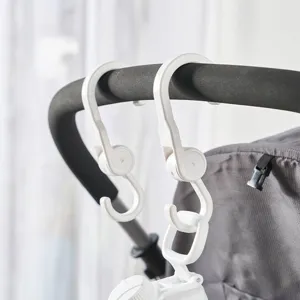 Set of two white rotating multifunctional plastic hooks for stroller and car use