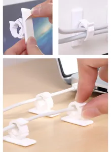 Vue détaillée des clips de câble blancs adhésifs pour une gestion organisée des fils