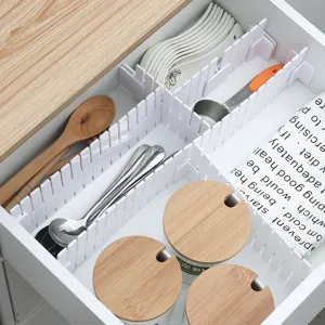 DIY adjustable white plastic drawer dividers for kitchen cutlery and jar organization