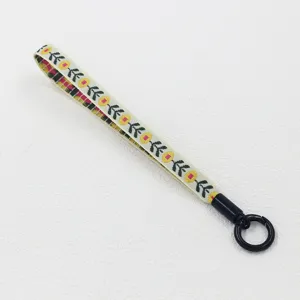 Ethnic style woven wrist lanyard strap with floral embroidery and black ring