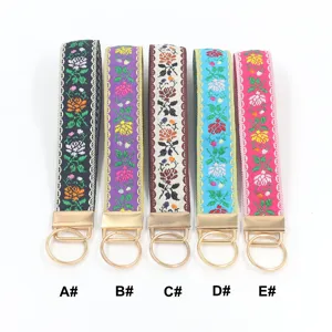 Fünf ethnische bestickte Blumenarmband-Schlüsselanhänger mit goldenen Metallringen Set