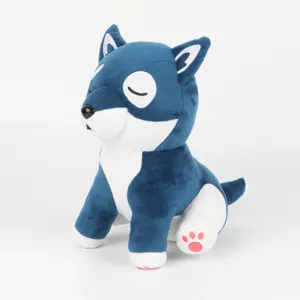 Vue détaillée d'un chien en peluche bleu et blanc avec des yeux fermés et une patte rose