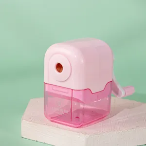 Pink manual pencil sharpener with crank handle and transparent shavings box detail view