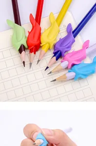 Silicone dolphin pen grips for kids writing posture correction, colorful student stationery detail.