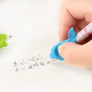 Close-up detail view of cute blue dolphin pen grip for comfortable writing posture.