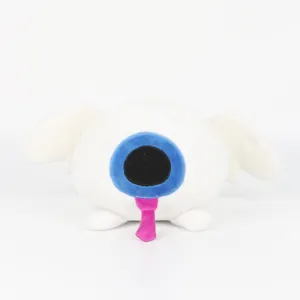 Poupée en peluche Taxduo avec un grand œil bleu et une langue rose sur fond blanc