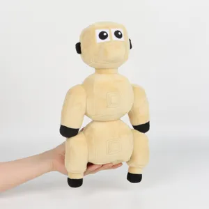 Detailed view of the soft yellow Voxel Robot Dog plush toy character being held by a hand