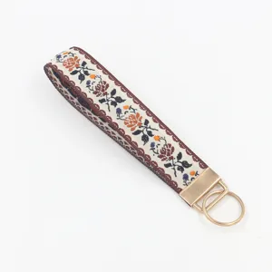 Ethno-Stil blumig besticktes Stoff-Handgelenk-Schlüsselband mit goldenem Metallring