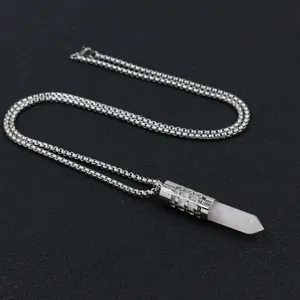 Close-up of hollowed-out stainless steel diffuser necklace with rose quartz point