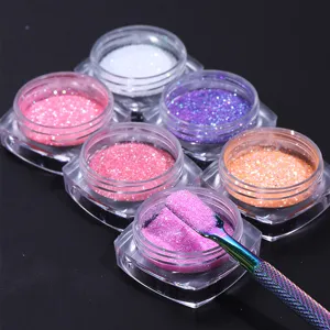 Detailed view of colorful nail sugar glitter powder jars with holographic metal tool