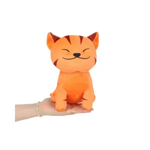 Cute orange Lofi Cat plush toy with smiling face held in hand on white background